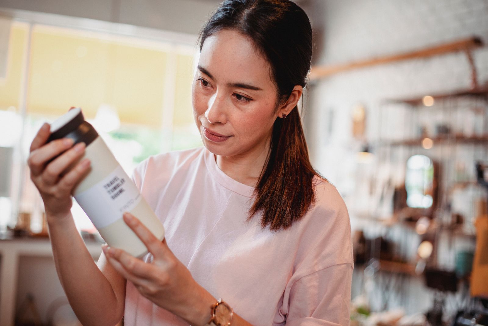 Shopper reading the label on a beauty product